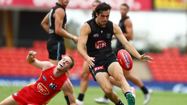 Josh Sinn gets a kick against the Suns. Picture: Chris Hyde/Getty Images