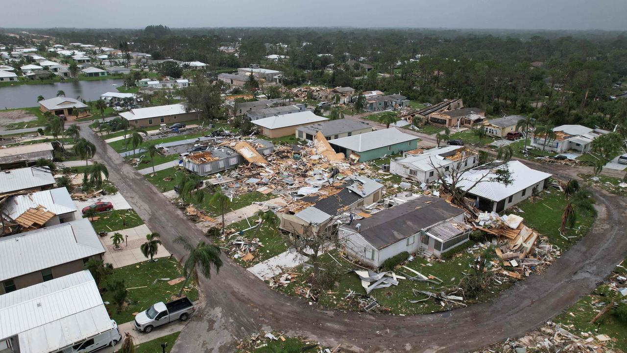 An aerial view shows destruction at the Spanish Lakes country club in Fort Pierce, Florida, in the aftermath of Hurricane Milton on October 10, 2024. At least 10 people were dead after Hurricane Milton smashed into Florida, US authorities said, after the monster weather system sent tornados spinning across the state and flooded swaths of the Tampa Bay area. (Photo by John Falchetto / AFP)