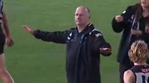 Ken Hinkley gestures to Jack Ginnivan that he won't be on a flight.