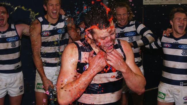 Sam Menegola is drenched in Gatorade after finally playing his first game. Picture: Getty Images