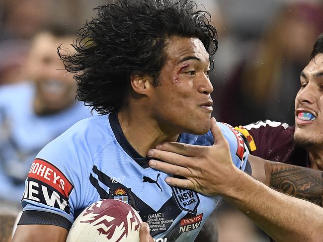 TOWNSVILLE, AUSTRALIA - JUNE 09:  Brian To'o of the Blues is tackled during game one of the 2021 State of Origin series between the New South Wales Blues and the Queensland Maroons at Queensland Country Bank Stadium on June 09, 2021 in Townsville, Australia. (Photo by Ian Hitchcock/Getty Images)