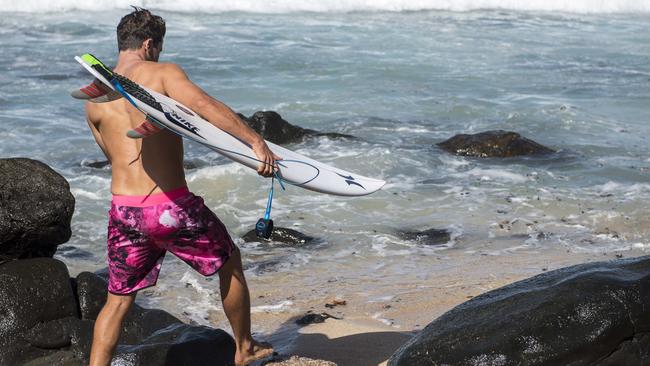 Julian Wilson wearing pink board shorts to raise awareness of breast cancer.