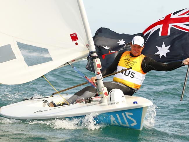 Tom Slingsby celebrates after winning a gold medal in the Laser at the London Olympics. Pic: Chris Ison/PA Wire