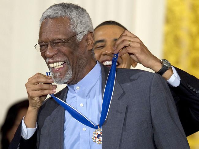 (FILES) In this file photo taken on February 14, 2011, US President Barack Obama awards the 2010 Medal of Freedom to NBA basketball hall of famer and human rights advocate Bill Russell during a ceremony at the White House in Washington, DC. - NBA great Bill Russell, the cornerstone of a Boston Celtics dynasty that won 11 titles and a powerful voice for social justice, has died at the age of 88, a statement posted on social media said July 31, 2022. (Photo by Jim WATSON / AFP)