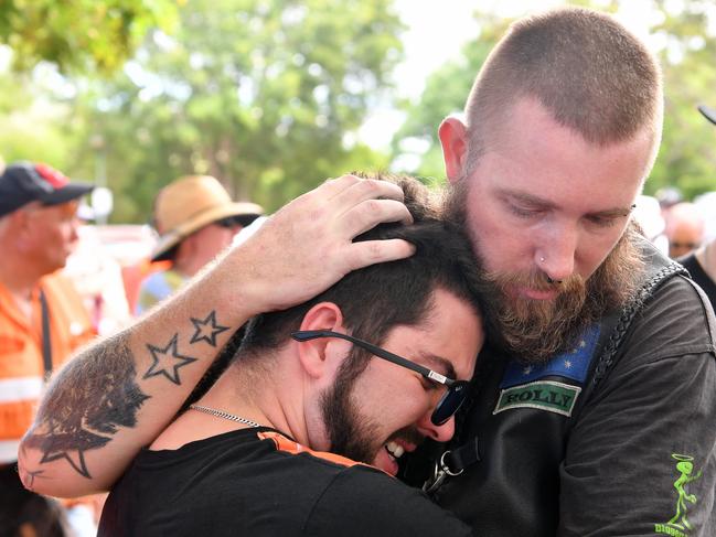 Jennifer Board’s friend Dean Geiszler (left) gets support from a mate at the scene of the crash. Picture: Evan Morgan