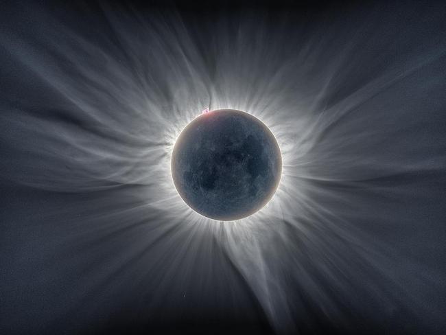 Sun Flower Corona ... A composite of 12 images taken during the total solar eclipse on 9 March 2016 from Tidore Island in Eastern Indonesia. Resembling tentacles, the blistering solar coronal structures reach out from the Sun’s surface with an average temperature of between one and three million kelvin. In this striking image, the features on the Moon’s face are also visible, but not because of the light from the Sun. The Moon is in fact illuminated by the sunlight reflected from our very own planet in a phenomenon known as Earthshine. The pink glow at the top left of the Moon comes from a solar prominence. Picture: Catalin Beldea Alson Wong, Insight Astronomy Photographer of the Year 2016 Our Sun Runner-up