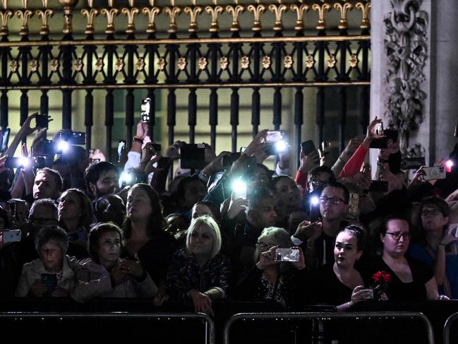 Londoners outside of Buckingham Palace as the coffin of Queen Elizabeth II arrives. AFP