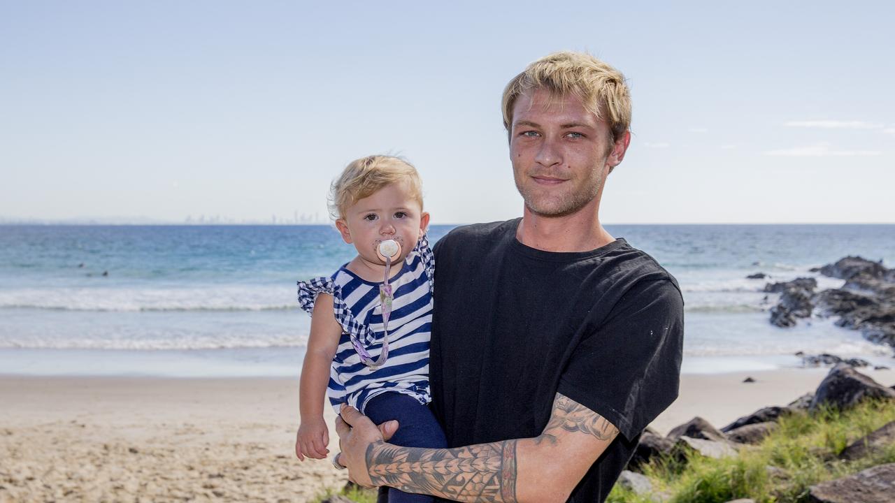 Andrew Pethers and Poppy Pethers, 1, at Snapper Rocks. Picture: Jerad Williams