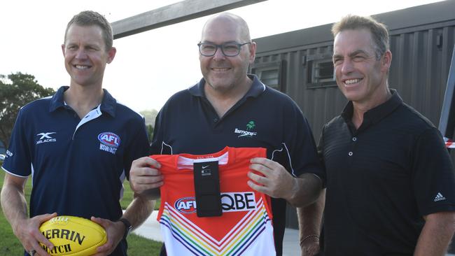 Left: Two-time Premiership midfielder with the Sydney Swans now AFL NSW/ACT Coaching Development and Education Lead Ryan O’Keefe, Lismore Mayor Steve Krieg and four-time Premiership winning coach with Hawthorn now current AFL Community Coaching Ambassador Alastair Clarkson present Lismore with a signed Sydney Swans guernsey. Picture Cath Piltz