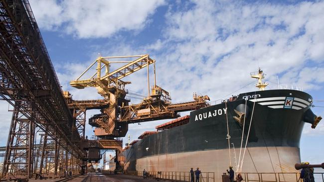 Iron ore is loaded onto a freighter at a Brazilian port. Picture: Bloomberg