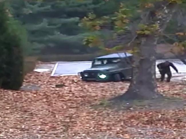 A North Korea defector running from a vehicle at the Joint Security Area of the Demilitarized Zone (DMZ). Picture: AFP