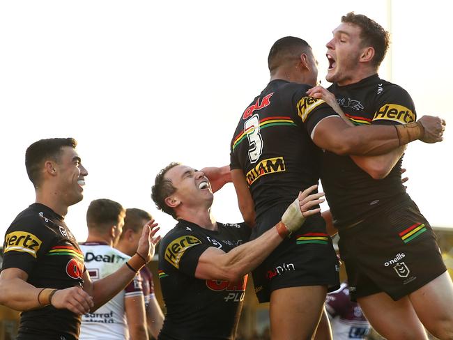 Stephen Crichton of the Panthers celebrates with teammates after scoring a try. Picture: Matt Blyth/Getty Images