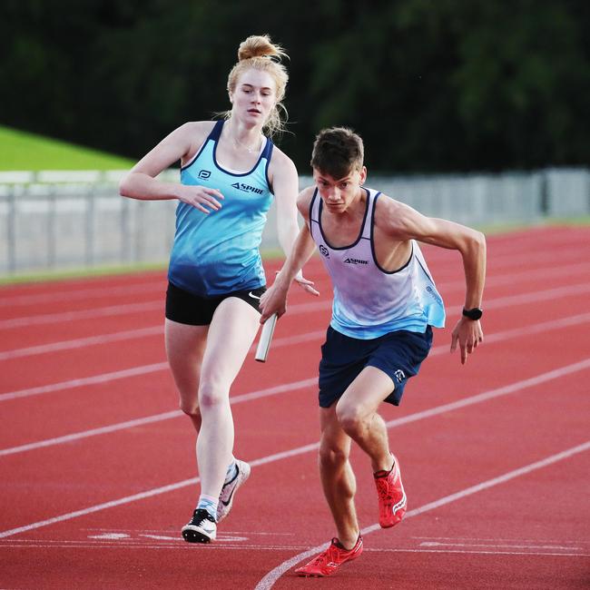 Aspire Cairns and the Pace Project joined forces on Monday afternoon to run a marathon relay at Barlow Park. Emma Henley hands Luke Melellan the baton for the final lap of the race. PICTURE: BRENDAN RADKE