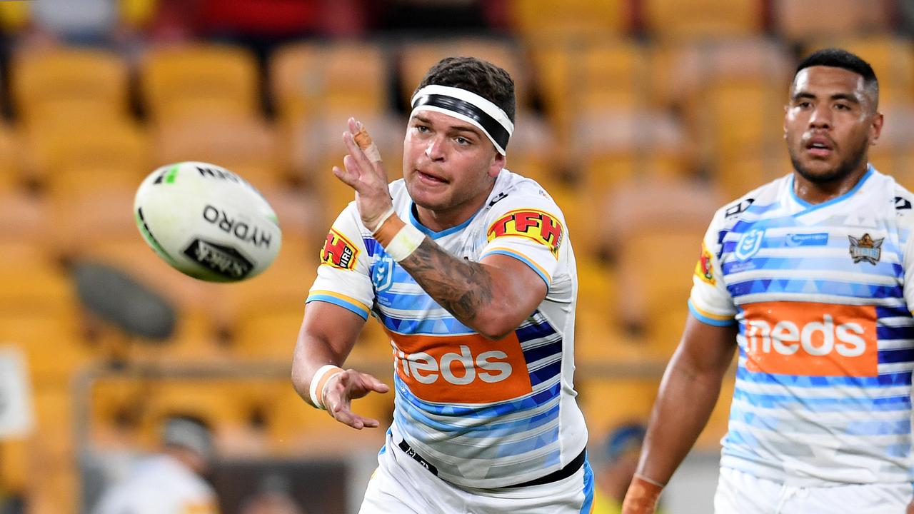 Ashley Taylor of the Titans (left) is seen during the Round 7 NRL match between the Brisbane Broncos and the Gold Coast Titans at Suncorp Stadium in Brisbane, Saturday, June 27, 2020. (AAP Image/Dan Peled)