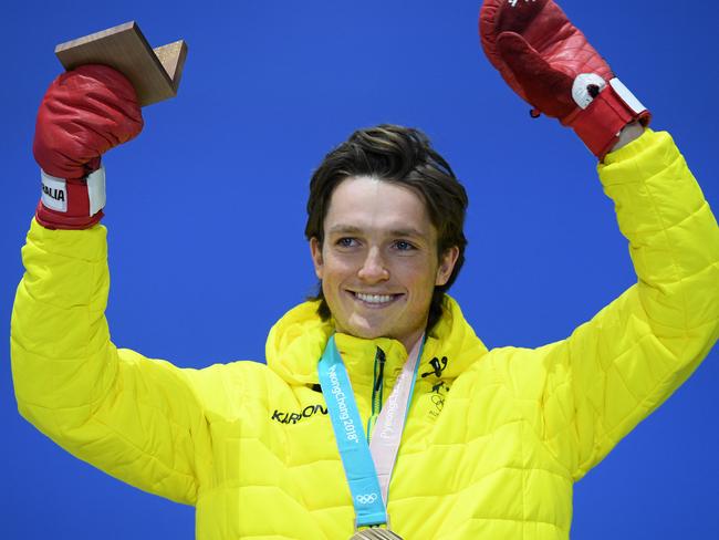 Scotty James of Australia receives the bronze medal in Men's Snowboard Halfpipe, during a medal ceremony at the PyeongChang Olympic Plaza, during the PyeongChang 2018 Winter Olympic Games, in PyeongChang, South Korea, Wednesday, February 14, 2018. (AAP Image/Dan Himbrechts) NO ARCHIVING, EDITORIAL USE ONLY