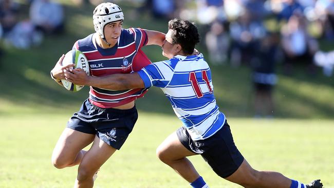 Action pics of the Round 1 GPS Rugby blockbuster between The Southport School and Nudgee College at TSS. Photo of Dion Samuela (TSS) and Robert Mapa. Photo by Richard Gosling