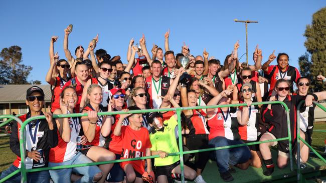 Bambill won both the men’s and women’s grand finals last year, with both teams gathering to celebrate the double achievement. Picture: Glenn Milne