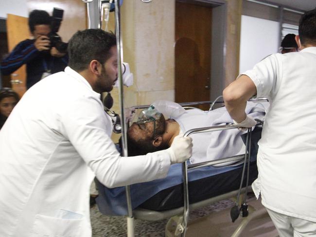 Alan Ruschel, a defender for the Brazilian soccer team Chapecoense, is wheeled into a hospital in La Ceja, Colombia. Picture: AP