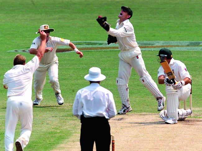 Glory days: Gilchrist takes a catch off Warne’s delivery in a 2002 Test. Picture: Brett Costello