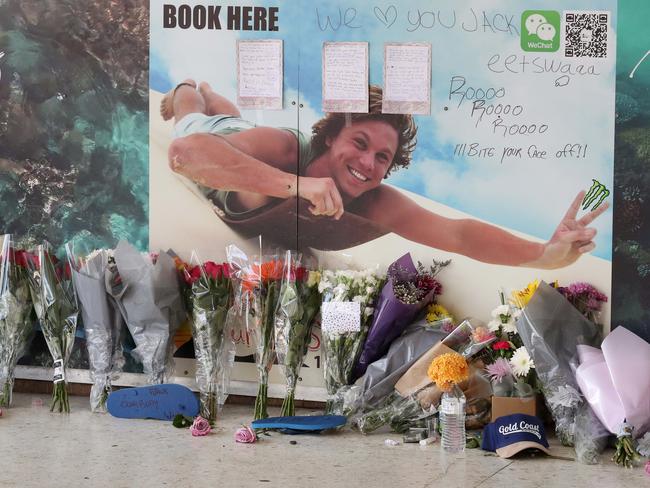 Flowers, hand written notes and other items left by the friends of murder victim Jack Beasley at the scene of the tragedy outside the Surfers Paradise IGA. Photographer: Liam Kidston.