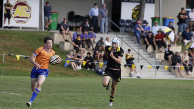 Ted Clarke makes a break for Ashgrove against ST Laurence's. He deserved his spot on the bench.