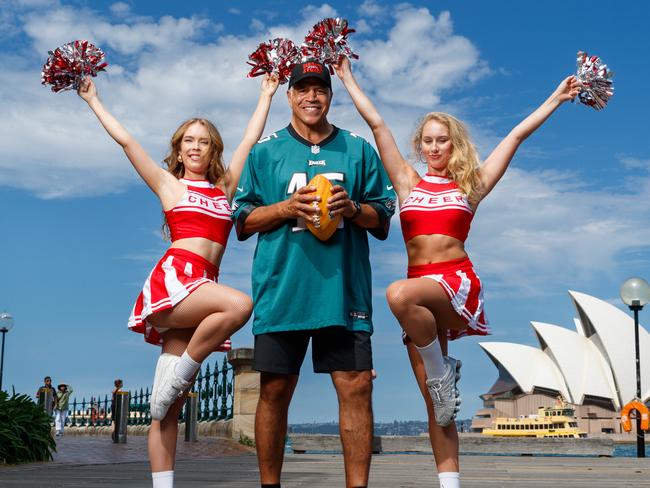 DAILY TELEGRAPH. Former NBL player and sports broadcaster Steve Carfino will MC the official Super Bowl event at Coogee on Monday, alongside cheerleaders Tegan Hannaford and Rylee Lister. Pictured with the Opera House at Sydney Harbour. Saturday 08/02/2025. Picture by Max Mason-Hubers