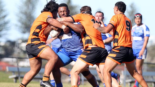 Tugun Seahawks (blue) vs. Southport Tigers at Tugun. Reserve Grade. Joseph Tangeria tackled high. 6 June 2021 Tugun Picture by Richard Gosling