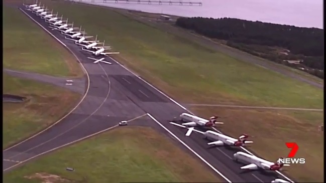 Incredible footage of planes grounded at Brisbane Airport (7 News)