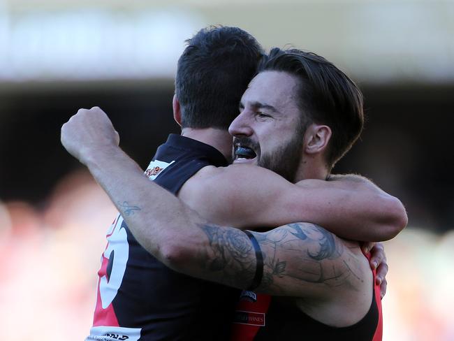 Hill celebrates West Adelaide’s 2015 grand final win with Adam Hartlett. Picture: Calum Robertson