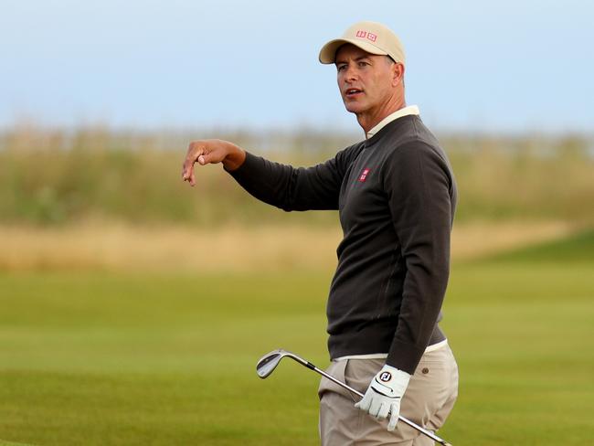 Adam Scott reacts after holing his bunker shot for a birdie on the first hole on day one of The Open. Picture: Andrew Redington/Getty Images