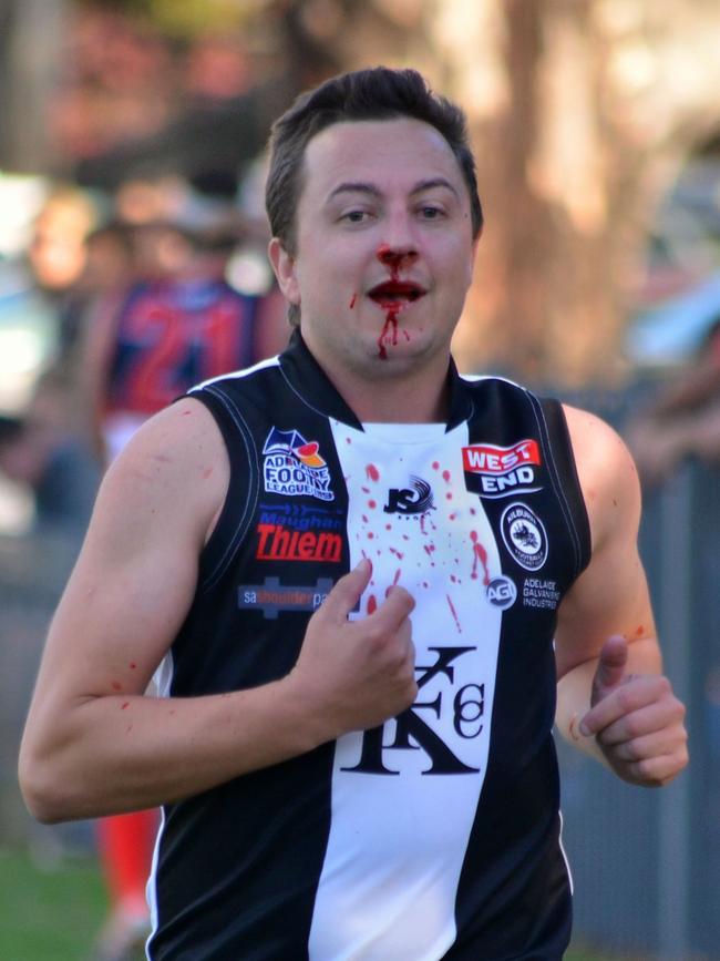 Kilburn footballer Chad Parks runs from the field on Saturday. Picture: Mathew Long/LongTime Photography.