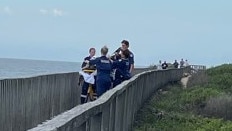 NSW Ambulance personnel at the scene near Hungry Head, Urunga, NSW. Picture: Janine Watson