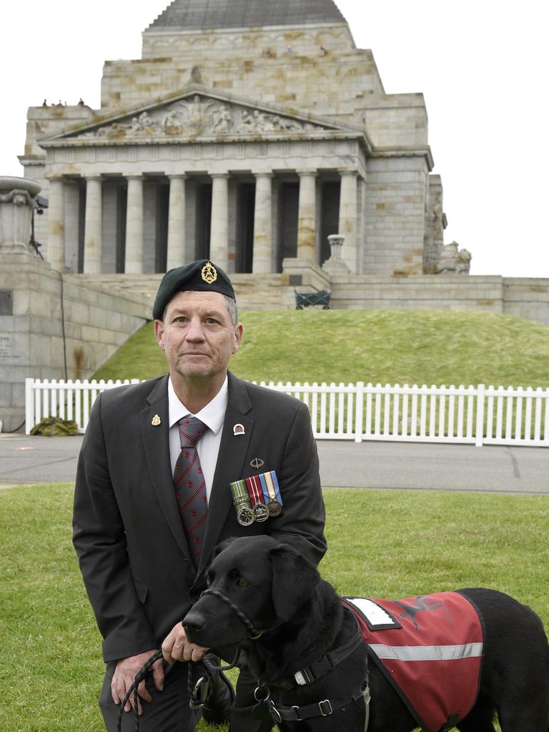 James Farquharson with his service dog Penny at Remembrance Day commemorations at the Shine. Picture: Andrew Henshaw