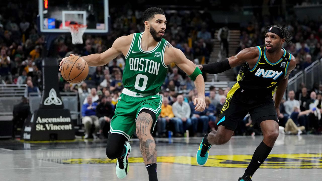 INDIANAPOLIS, INDIANA - JANUARY 06: Jayson Tatum #0 of the Boston Celtics dribbles the ball while being guarded by Buddy Hield #7 of the Indiana Pacers in the fourth quarter at Gainbridge Fieldhouse on January 06, 2024 in Indianapolis, Indiana. NOTE TO USER: User expressly acknowledges and agrees that, by downloading and or using this photograph, User is consenting to the terms and conditions of the Getty Images License Agreement. Dylan Buell/Getty Images/AFP (Photo by Dylan Buell / GETTY IMAGES NORTH AMERICA / Getty Images via AFP)