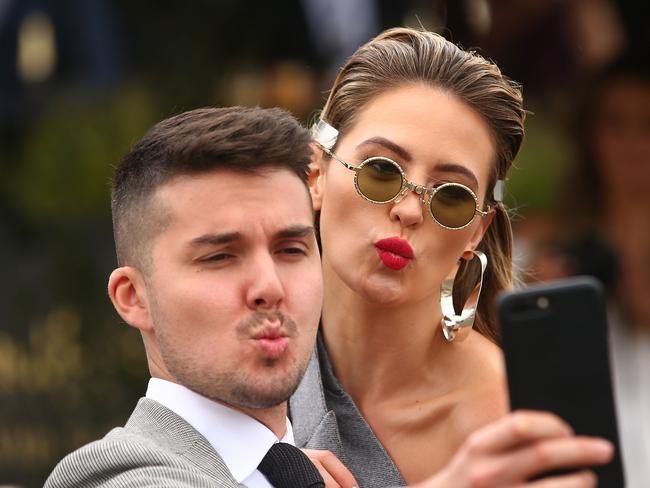 Jesinta Franklin gets in on a selfie at Caulfield Racecourse. Picture: Scott Barbour, Getty Images.