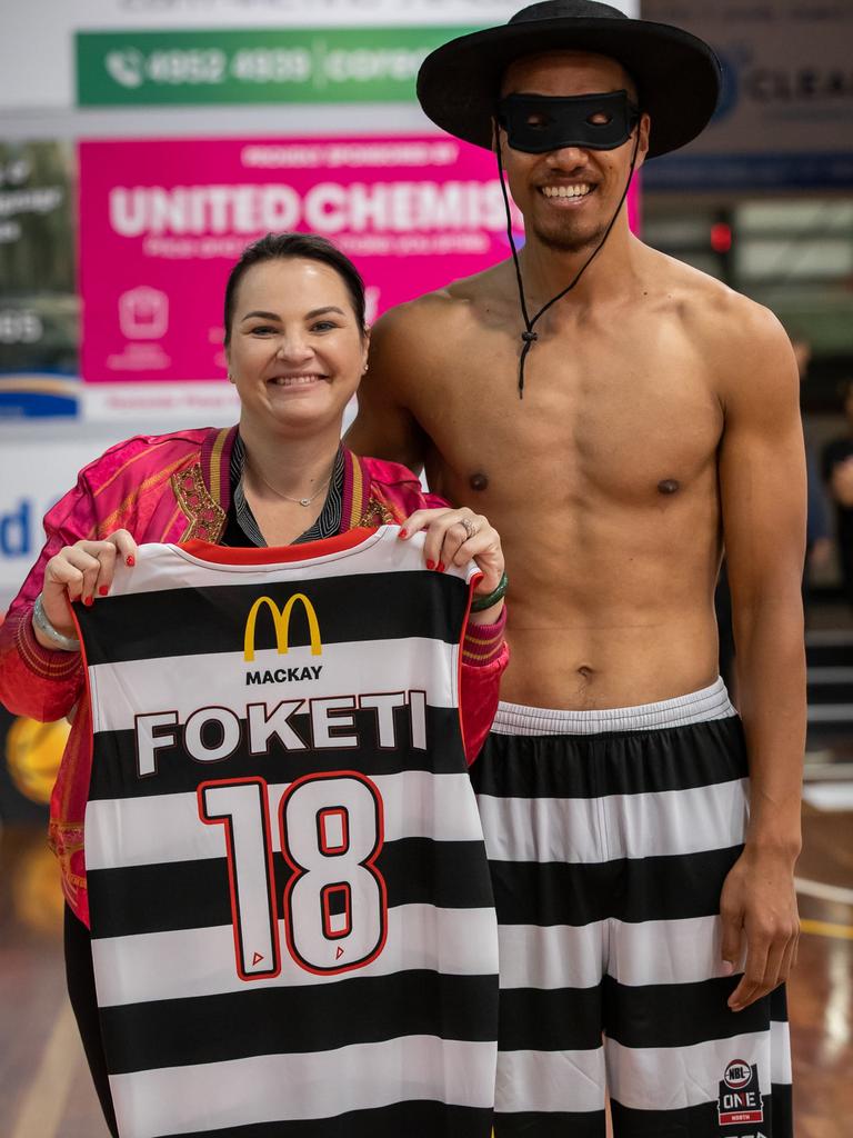 Niki Ramsay (left) won the auction for Viliami Foketi's match-worn jersey after Mackay Meteors defeated Cairns in the NBL1 North.