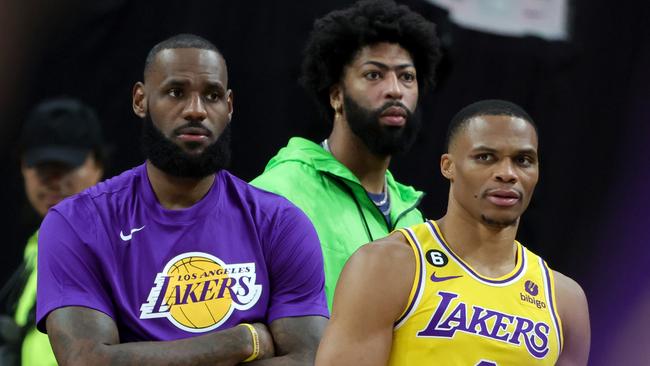 LAS VEGAS, NEVADA - OCTOBER 05: (L-R) LeBron James #6, Anthony Davis #3 and Russell Westbrook #0 of the Los Angeles Lakers react on the sideline after Westbrook was called for a technical foul on the bench in the third quarter of their preseason game against the Phoenix Suns at T-Mobile Arena on October 05, 2022 in Las Vegas, Nevada. The Suns defeated the Lakers 119-115. NOTE TO USER: User expressly acknowledges and agrees that, by downloading and or using this photograph, User is consenting to the terms and conditions of the Getty Images License Agreement. (Photo by Ethan Miller/Getty Images)