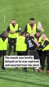 Pitch invader halts World Cup