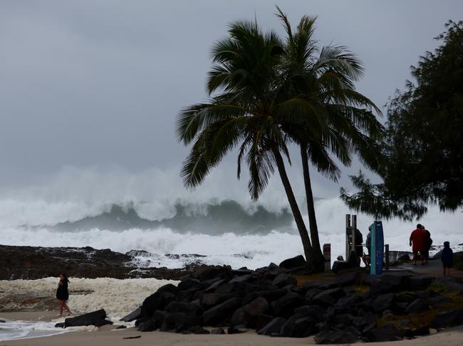 GOLD COAST, AUSTRALIA - MARCH 05: People watch the large waves at Snapper Rocks on March 05, 2025 in Gold Coast, Australia. Tropical Cyclone Alfred is expected to make landfall in southeast Queensland as a Category 2 storm, marking the first time a cyclone has directly hit the region in over 50 years. The storm is forecast to bring damaging winds, heavy rainfall, and potential storm surges, prompting authorities to urge residents to prepare for significant impacts, including flooding and power outages. (Photo by Chris Hyde/Getty Images)