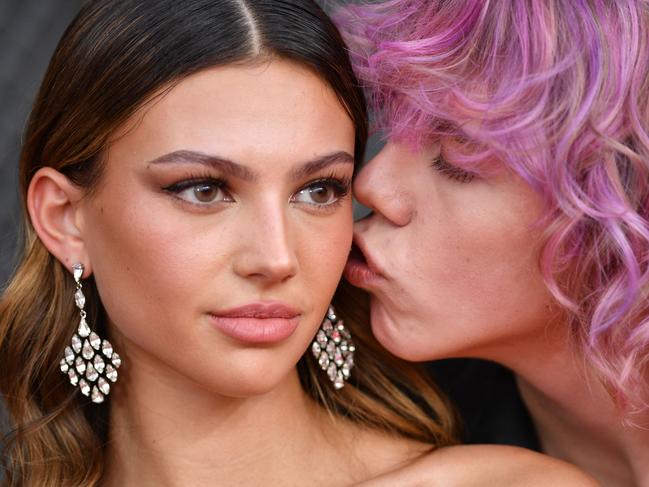 Australian rapper The Kid LAROI (R) and Katarina Deme arrive for the 64th Annual Grammy Awards at the MGM Grand Garden Arena in Las Vegas on April 3, 2022. (Photo by ANGELA WEISS / AFP)