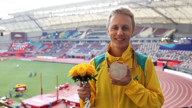 Jared Tallent poses with an upgraded silver medal. Picture: Christian Petersen/Getty Images