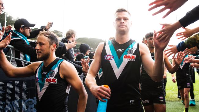 Peter Ladhams of the Power celebrates with fans after the win. Picture: Daniel Kalisz/Getty Images