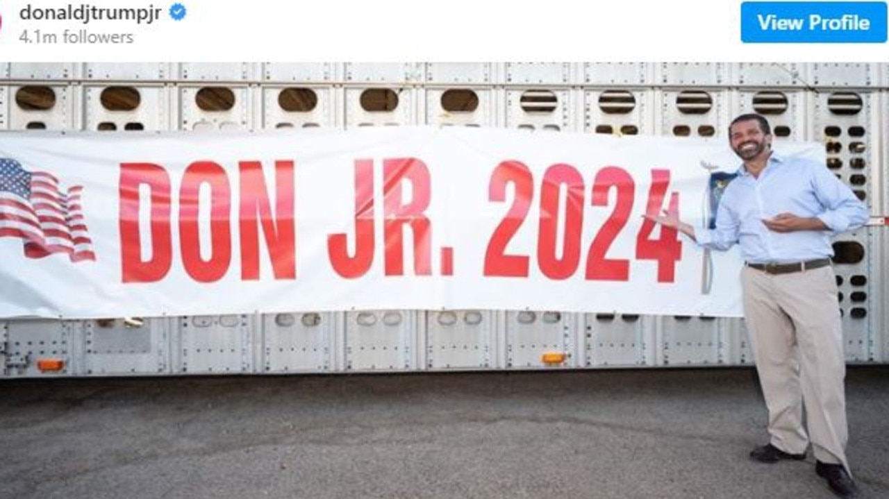 Donald Trump Jr with a banner made by a fan for his potential candidacy next time around. Picture: Instagram