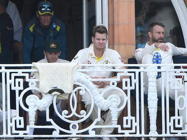 LONDON, ENGLAND - AUGUST 17: Australia coach Justin Langer tosses up a tennis ball on the players balcony as Steve Smith (c) looks on during day four of the 2nd Test Match between England and Australia at Lord's Cricket Ground on August 17, 2019 in London, England. (Photo by Stu Forster/Getty Images)