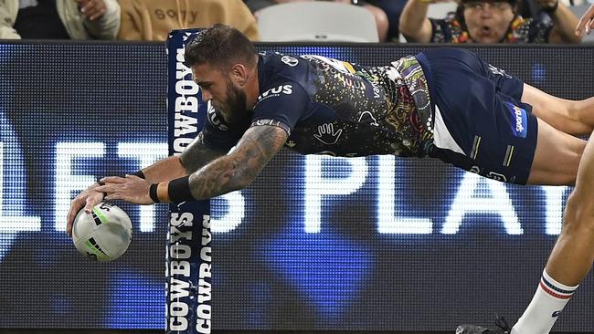 Kyle Feldt of the Cowboys scores a try during the round 12 NRL match between the North Queensland Cowboys and the New Zealand Warriors at QCB Stadium. (Photo by Ian Hitchcock/Getty Images)