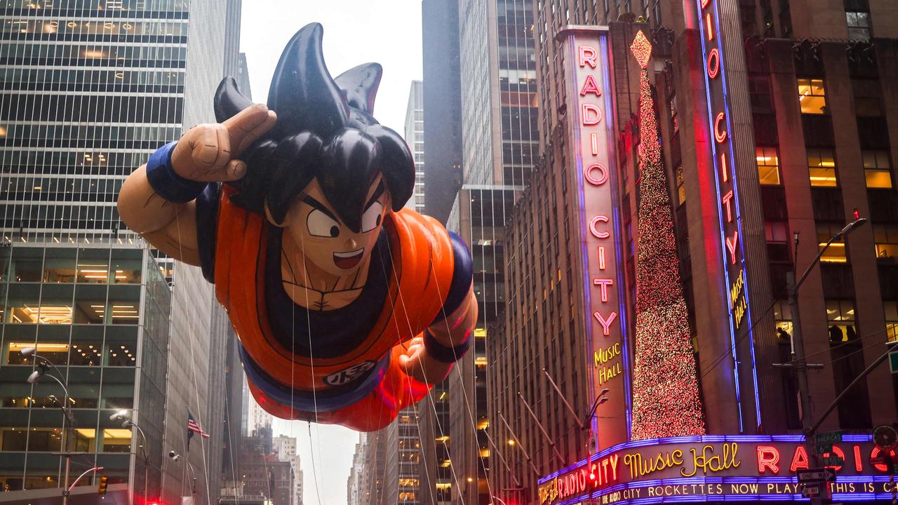 Goku, from Dragon Ball, floats down the busy New York streets. Picture: Charly Triballeau / AFP