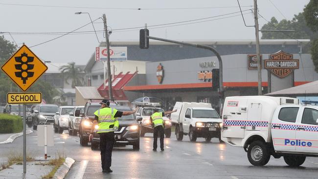 Police officers direct traffic on Sheridan Street, Cairns North, after the road was closed near the Airport Avenue intersection. Picture: Brendan Radke