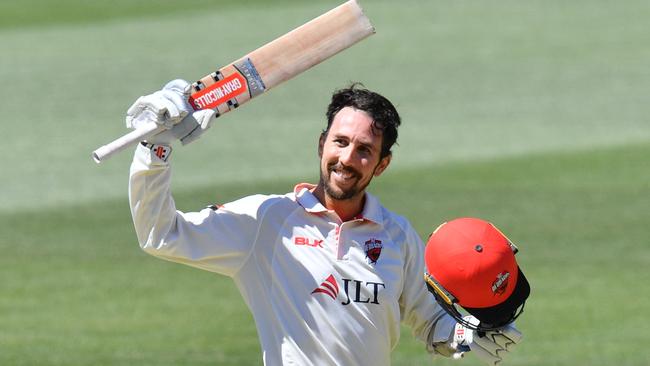 Tom Cooper salutes after scoring his 11th first-class ton for the Redbacks. Picture: AAP Image/David Mariuz