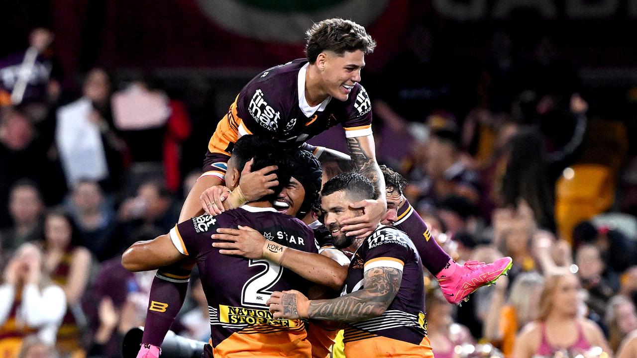 Reece Walsh, Deine Mariner, Brendan Piakura and Adam Reynolds of the Broncos celebrate. Photo by Bradley Kanaris/Getty Images.