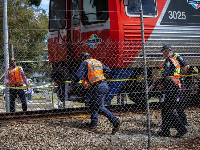 ADELAIDE, AUSTRALIA - NewsWire Photos MARCH 1, 2023: Emergency services at the scene of a serious rail crash at East Grange train crossing where a pedestrian was struck by a train near Terminus Street, Grange, near McLean Avenue, just after 1.30pm. Picture NCA NewsWire / Emma Brasier